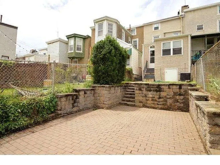 rear yard with one-car parking space
