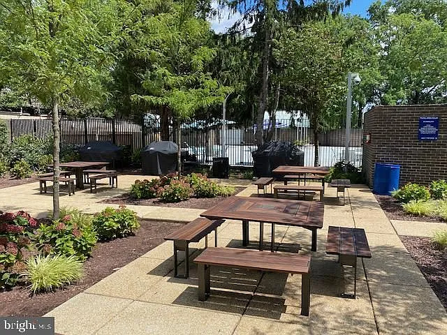 The picnic area has three gas BBQs next to the pool.