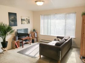 Experience the best of Seattle living at 2111 N 63rd in the sought out neighborhood of Greenlake!