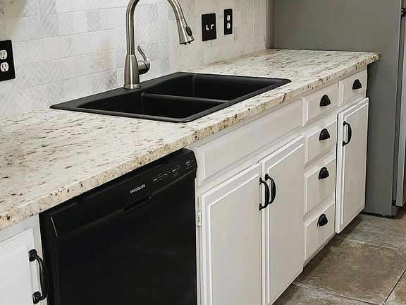New countertops and black appliances