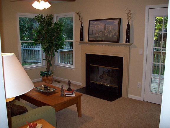 Den located off kitchen