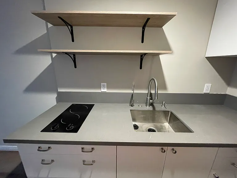 Garbage disposal and integrated soap dispenser.