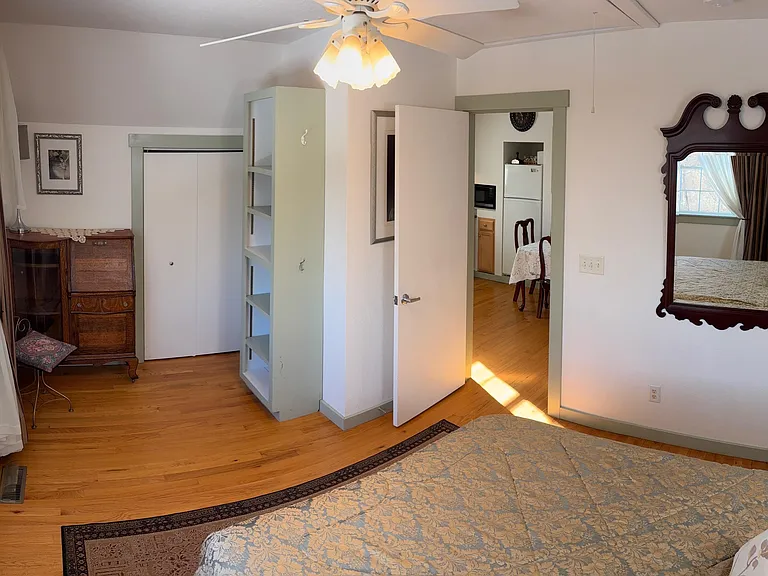 There are ceiling fans in both the Bedroom and the main Living.