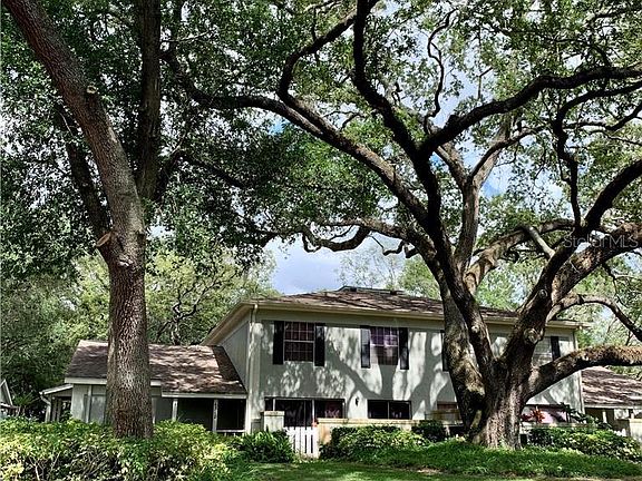 Two-story townhome. Lots of oak trees in the community.