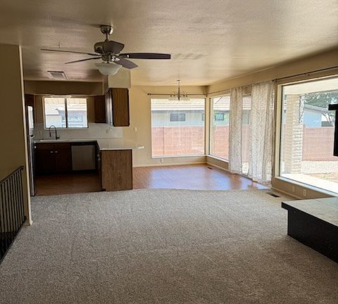 View of kitchen and dining area from front entry