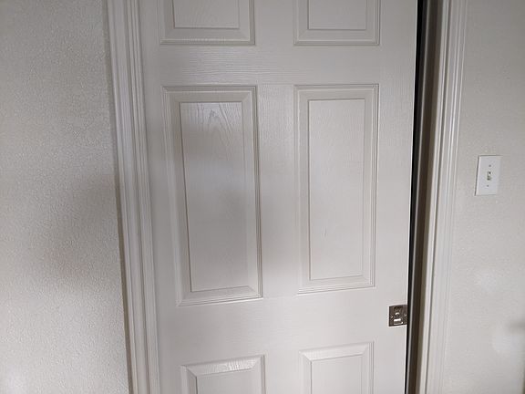 Sliding Door Separating laundry room and Kitchen.