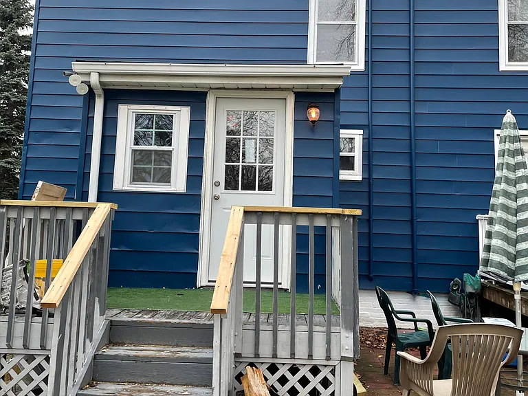 Back private entrance into dining room/office space. Slate patio in the works for barbecuing this Spring