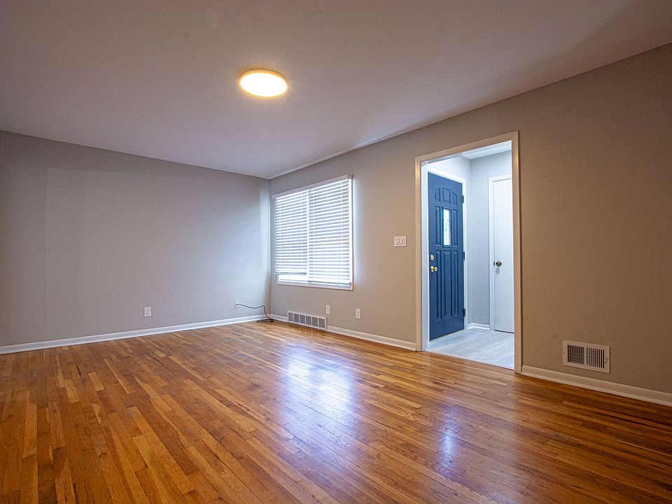 Spacious living room with a coat closet inside the entryway.