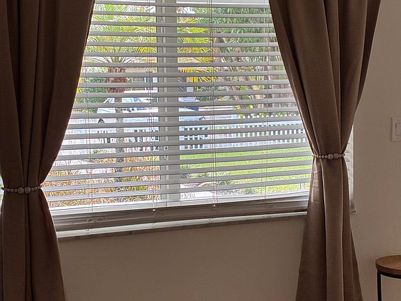 New room darkening drapery in living area