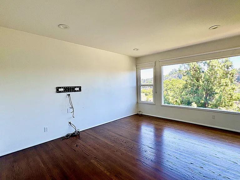 Integrated media wall with concealed wiring and pre-installed TV mount.