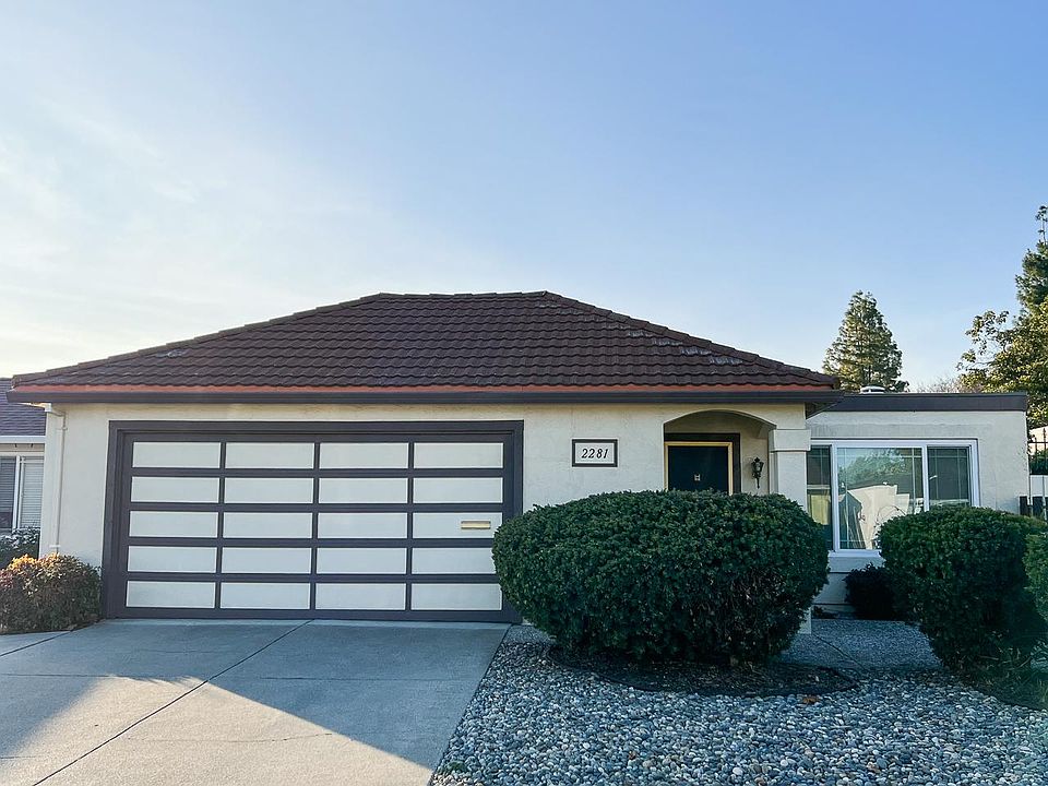 Front of home with low-maintenance landscaping.