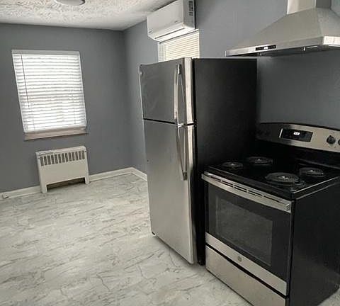 Kitchen...new refrigerator, range, hood vent