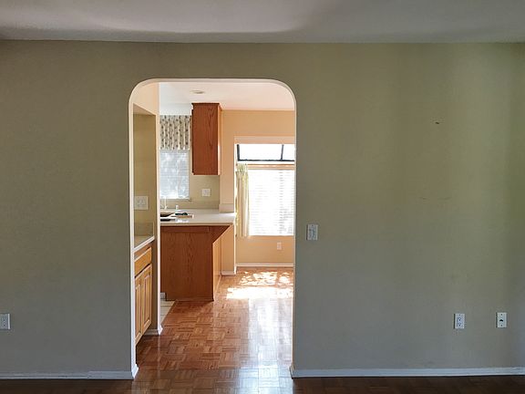 LOOKING TO KITCHEN AND FAMILY ROOM