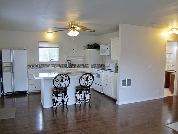 The living room is open to the beautiful kitchen