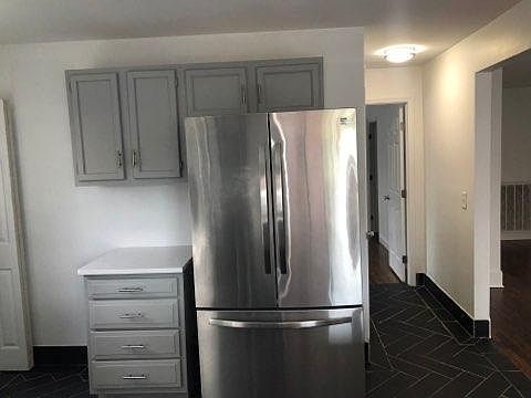 Large kitchen with stainless appliances