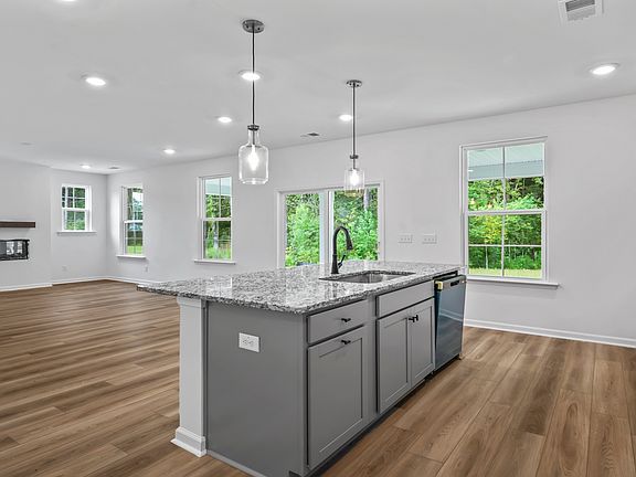 Spacious open layout connects the kitchen and living
