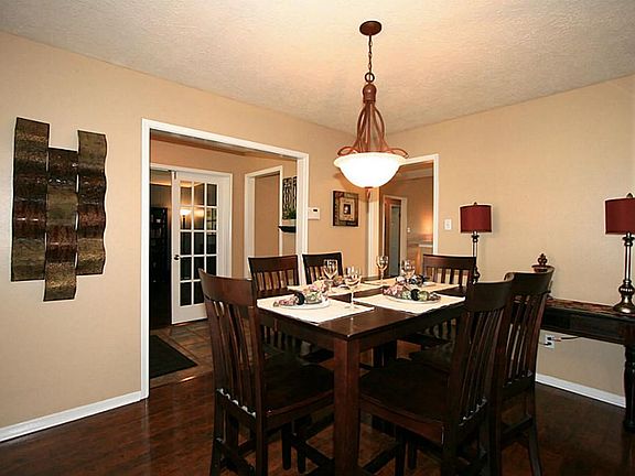 ANOTHER VIEW OF DINING, SHOWING CONVENIENT ACCES TO KITCHEN.