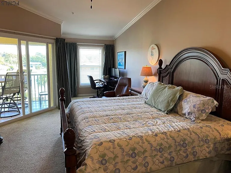 Primary bedroom with king size bed and office alcove.