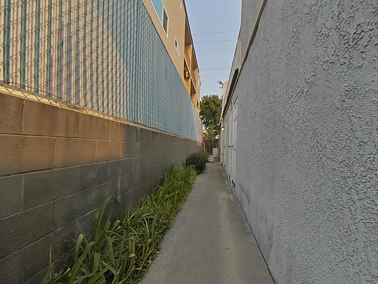Side of apartment with view of other to the street