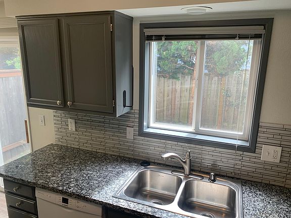 view of private patio area from kitchen access.