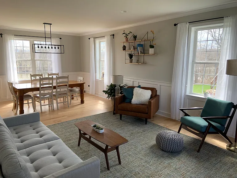 Furnished formal sitting area and dining room.