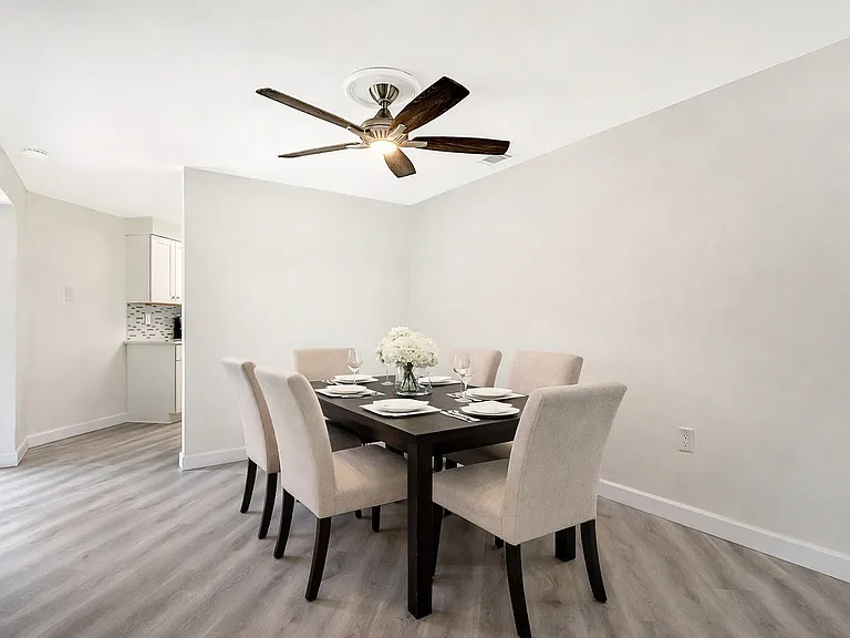Dining area virtually staged with AI generated furniture