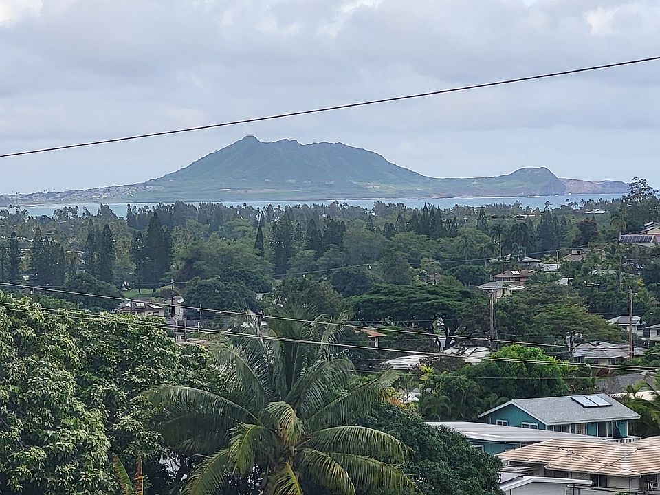 Upstairs lanai view of Mokapu Peninsula with Kailua Beach in the forefront. When the surf is big, you can see waves crashing against the rocks in the distance.