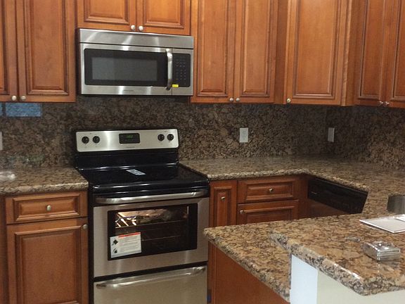 WOOD KITCHEN WITH GRANITE COUNTERTOPS