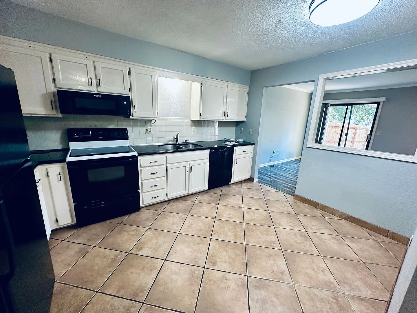  1423 Updated Townhome + Two Car Garage + Fenced Yard + Lawncare Included — Photo 3