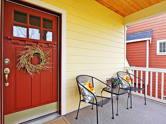 Large covered front porch overlooking community park is great place to relax and read the paper and enjoy your morning coffee.