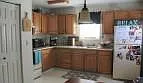 Open concept kitchen with a walk out patio. - 781 Crowell Rd #1
