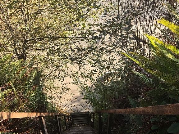 The last four bottom steps to the beach are on a hinged section of stair.  That section can be folded up by a person standing above it, using an installed pulley system.  It can then be secured with a section of chain and padlock to limit access to the cabin from the beach.