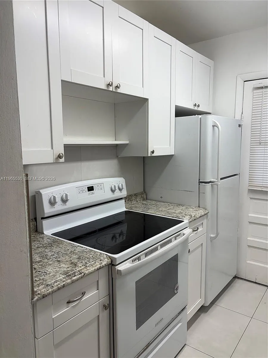 Building Photo - 1475 NE 125th Ter #403B
