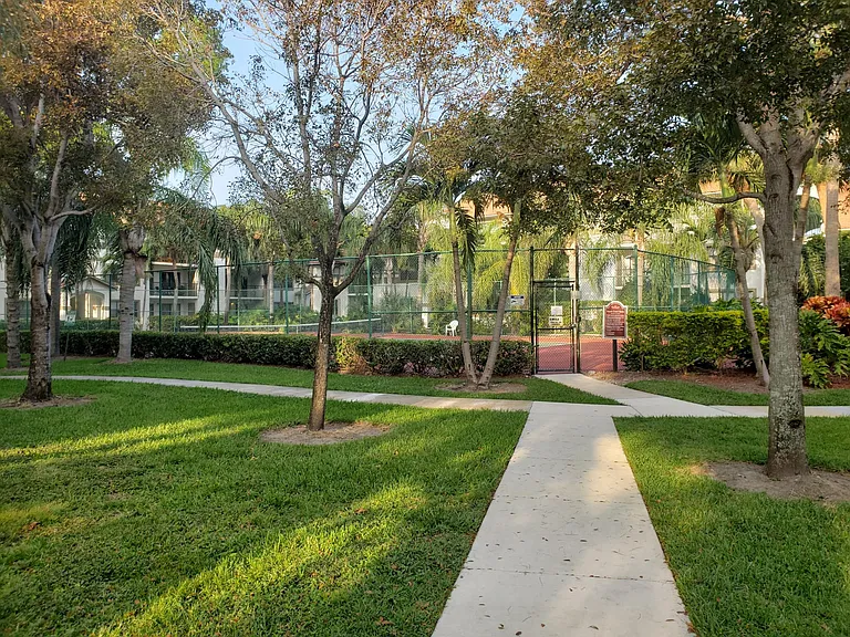 Regulation size tennis court. We are located in nicely shaded areas, which keeps electricity bill lower.