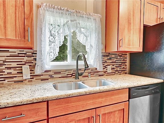 Nicely updated kitchen with all stainless steel appliances and granite counter tops. 