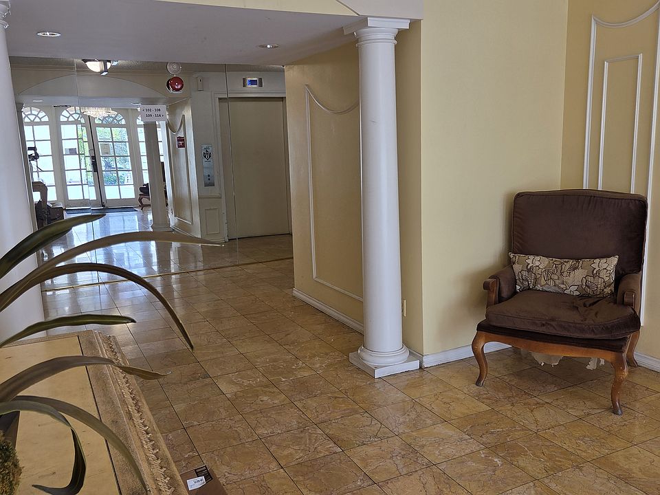 Lobby View from Entry Door (it's reflected by the mirrored wall at the far end)