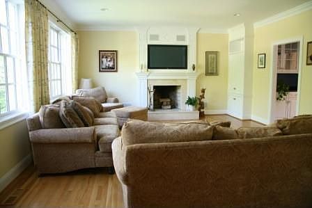 Family room with built-in plasma TV, surround sound, built in cabinets.