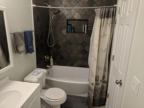 Recently renovated upstairs full bathroom with tiled shower 