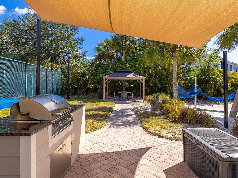 Fire up the grill and relax in the gazebo or hammocks, all surrounded by lush tropical landscaping.