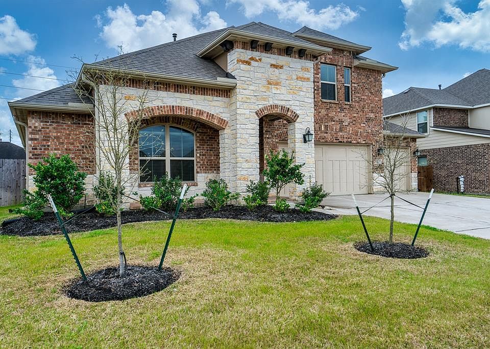 Gorgeous 1.5 story home with brick and stone exterior located in McKenzie Park in Spring, Texas.