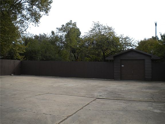 Huge area for parking or for the kids to play! Detached garage has entrance and exit doors!