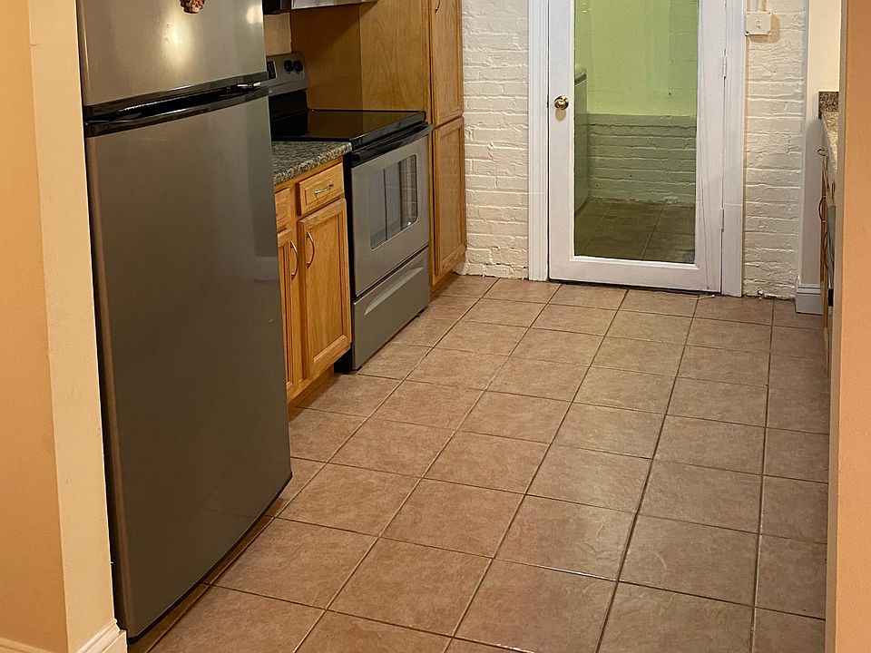 Stainless steel kitchen appliances,
Exit to laundry room and backyard.