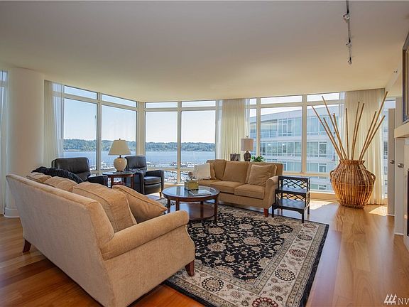 Living room with floor-to-ceiling windows on a curve with fantastic marine views!