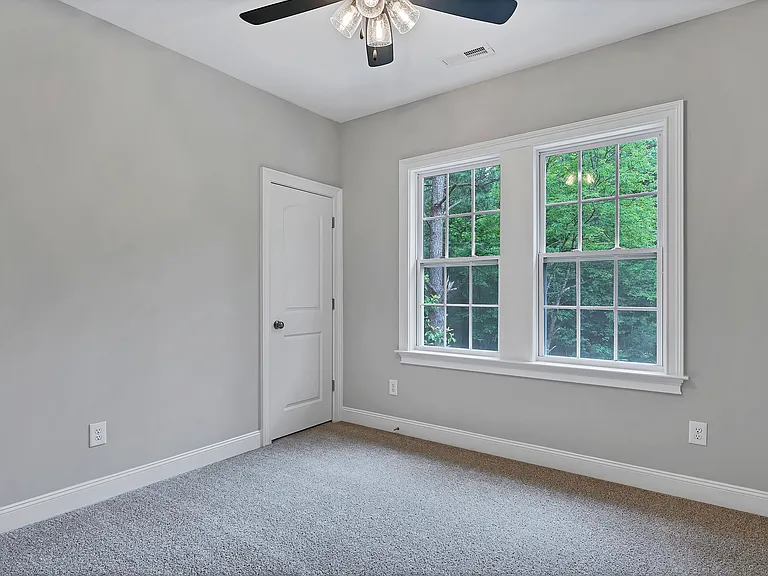 bedroom 1 with lightened closet and window