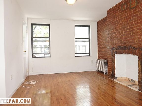 Decorative fireplace and exposed brick