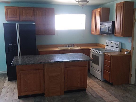Kitchen, island has granite counter