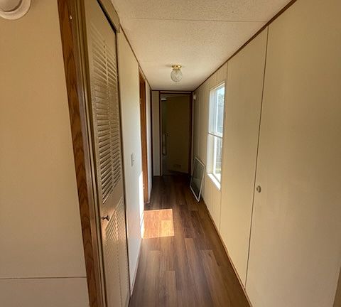 Hallway to 2nd and 3rd bedroom and second full bathroom.
