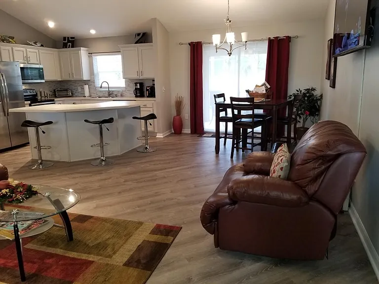 Living Room with a 65 inch TV, Kitchen, Dining Room