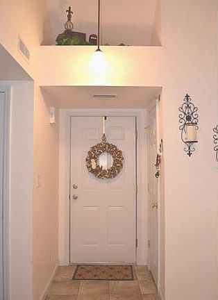 Welcoming Foyer with upper shelf alcove!