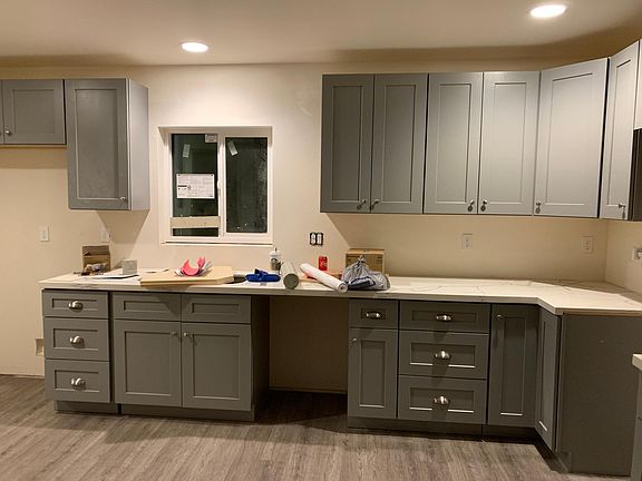 Beautiful gray cabinets! White subway tile backsplash to be installed. Stainless steel appliances arriving next week.